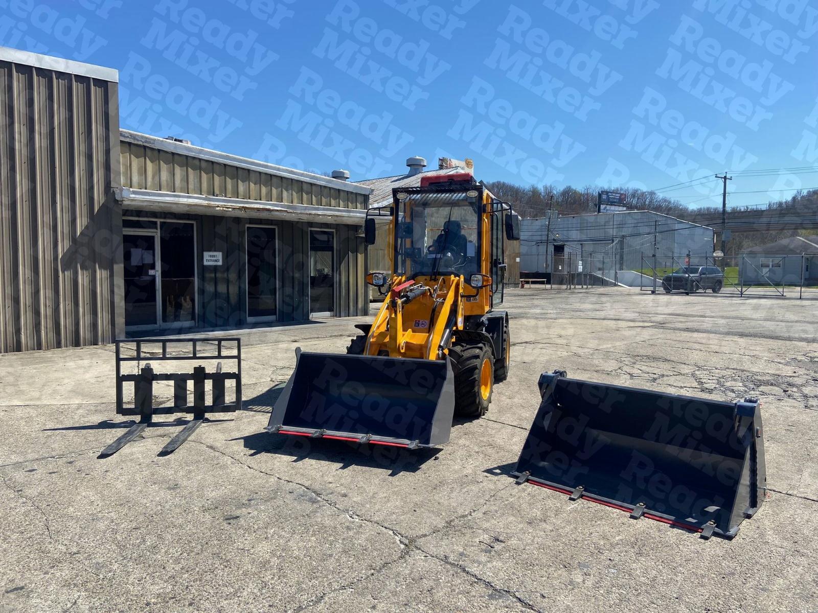 Yellow compact wheel loader displayed with multiple attachments including pallet forks and material buckets