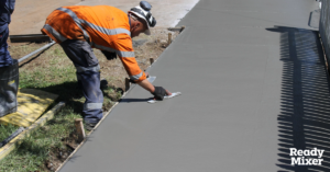 Person Troweling Fresh Concrete