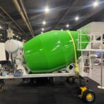 Ready Mixer green concrete mixer and aggregate hopper system shown at trade exhibition