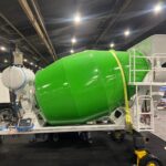 Ready Mixer green concrete mixer and aggregate hopper system shown at trade exhibition