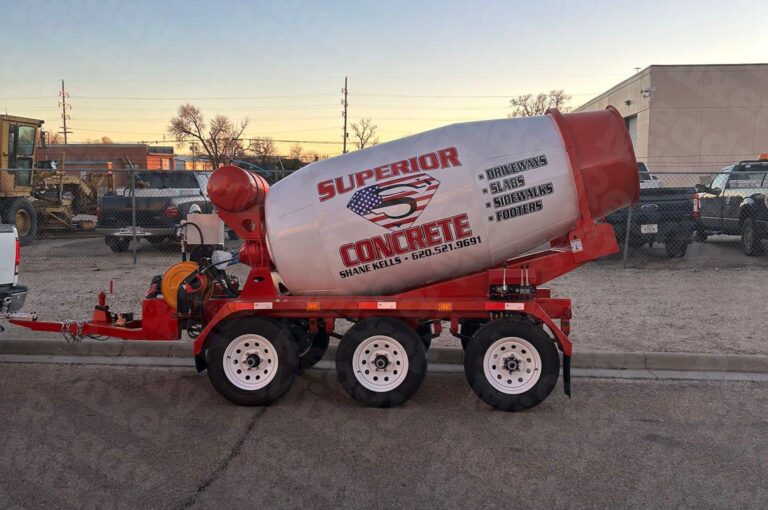 Red and white Superior Concrete Ready Mixer truck with 3-yard capacity and water attachment